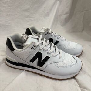 New balance 574 black and white. Only worn one time.